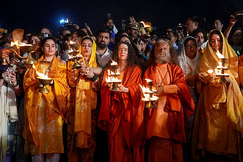 (R-L) Bollywood actor Katrina Kaif, spiritual leader Swami Chidanand Saraswati, Sadhvi Bhagawati Saraswati, Bollywood actor Raveena Tandon and her daughter Rasha Thadani rotate traditional oil lamps to perform an evening ritual 'Aarati' Sangam during the Maha Kumbh festival, which is one of the world's largest religious gatherings, celebrated every 12 years in Prayagraj, Uttar Pradesh on Monday, Feb. 24, 2025