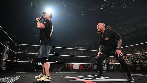 John Cena (L) and Randy Orton in the arena