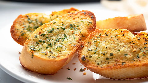Here are two reasons why garlic bread taste better in restaurants