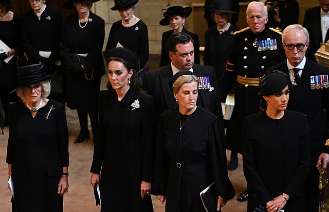Why do royal family members always carry black clothes while travelling?