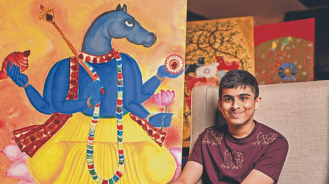 Akhil Anand with his artworks