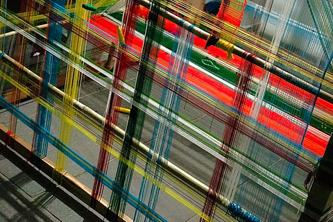 The art exhibition in the city reflects on the journey of textiles through multiple realms.