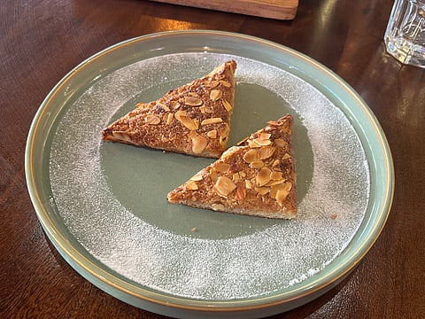 The menu consists of vegetarian and eggetarian dishes, alongside specialty coffee