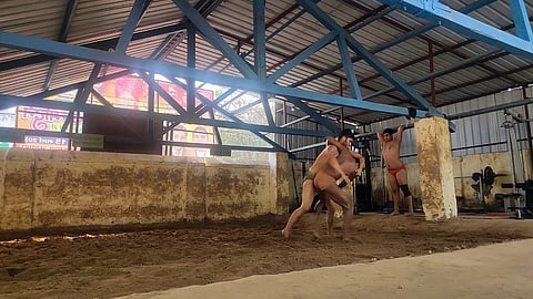Inside Delhi’s akharas, young wrestlers follow the grind of the mud-pit tradition 