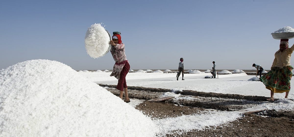 Why can't cremation fire burn the feet of these salt farmers from Gujarat