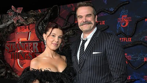 David Harbour says false reports about Millie Bobby Brown and on-set tensions contributed to a breakdown