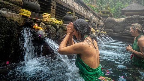 The Melukat ritual in Bali blends sacred water and prayer in a spiritual cleansing practice believed to help release negativity