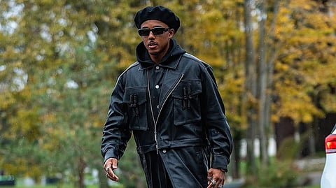 Barcelona footballer Jules Koundé wearing a stylish streetwear outfit, showcasing athlete fashion trends beyond the pitch