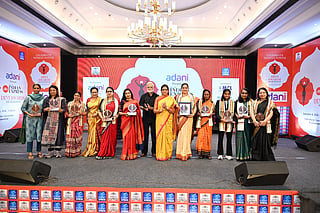 A picture from the event featuring senior TNIE officials and winners of The Devi Awards