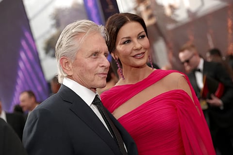 Michael Douglas and Catherine Zeta-Jones blow out candles together for joint birthday