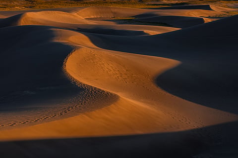 Why do sand dunes in Rajasthan sing?