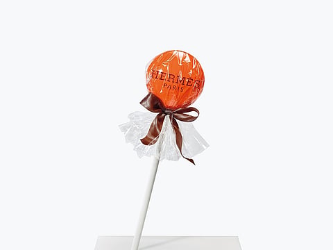 The Hermes lollipop is a playful keepsake handed to customers as a giveaway.