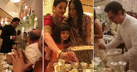 Twitter trolls Bollywood celebrities for serving food at Isha Ambani's wedding, Abhishek Bachchan responds 