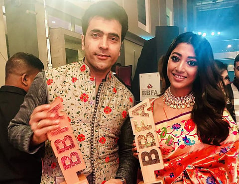 Abir Chatterjee who got the Special Jury Award along  with Rudranil Ghosh poses with Paoli Dam who got the award for Best Actress In a Leading Role for Konttho