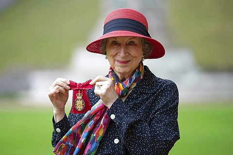 Author Margaret Atwood holds her award after she was made a Companion of Honour by Britain's Queen Elizabeth II at an investiture ceremony at Windsor Castle, England. Photo credits:Aaron Chown