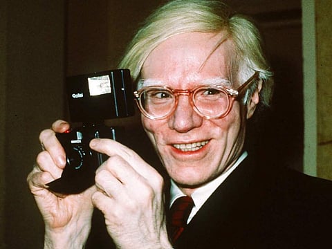 In this file photo dated 1976, showing pop artist Andy Warhol smiles in New York.  (AP Photo/Richard Drew, FILE)
