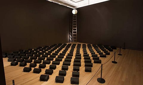 Steven Nunoda, “Ghostown” (2013), tar paper (courtesy Brian Boyle, Royal Ontario Museum) and Steven Nunoda, “Ladder to the Moon” (2013), mixed media installation (image by Brian Boyle, courtesy Royal