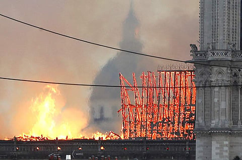 Flames rise from Notre Dame cathedral as it burns in Paris, Monday, April 15, 2019. (AP Photo/Thibault Camus)