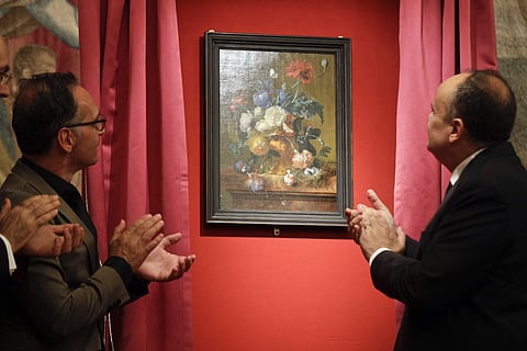 Unveiling of 'Vase of Flowers' by Jan van Huysum, at the Pitti Palace, Uffizi Galleries, in Florence, Italy. Germany returned the Dutch painting after it was stolen in WWII. (AP Photo/Gregorio Borgia)