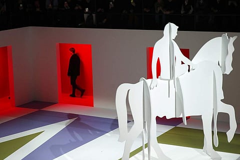 A model wears a creation as part of the Prada men's Fall-Winter 2020/21 collection, that was presented in Milan, Italy, Sunday, Jan 12, 2020. (AP Photo/Antonio Calanni)