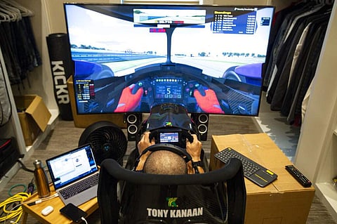 Brazilian IndyCar driver Tony Kanaan on his racing simulator (AP Photo/Michael Conroy)