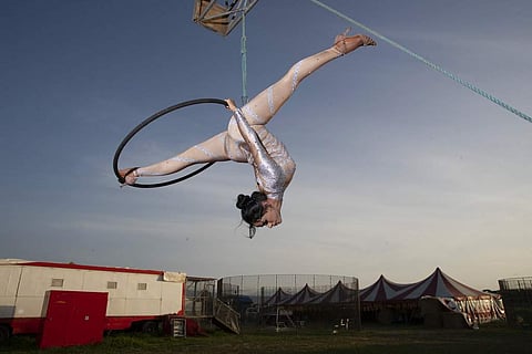 Otilia Maria Martinez Dos Santos performs at the Rony Roller circus on the outskirts of Rome. 'I miss the audience, the preparation, the emotion,' she says. (AP Photo/Alessandra Tarantino)