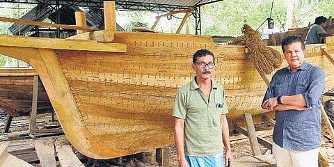 P O Hashim and chief carpenter Gokul Edathumpadikkal in front of the Uru