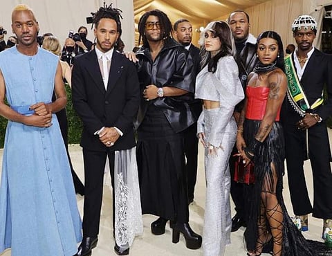 Lewis Hamilton with fashion designers at the Met Gala