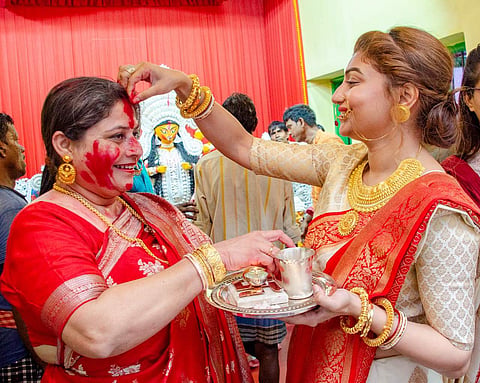 Suchandra Kundu and Priyadarshini smear sindoor on each other on Bijoya Dashami