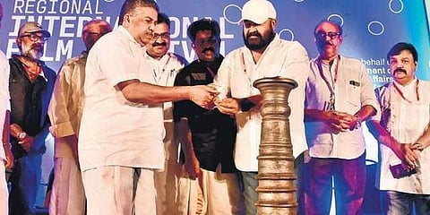 Cultural Minister Saji Cherian and actor Mohanlal at the inaugural function of the Regional International Film Festival of Kerala at Sarita Theatre in Kochi on Friday | Albin Mathew