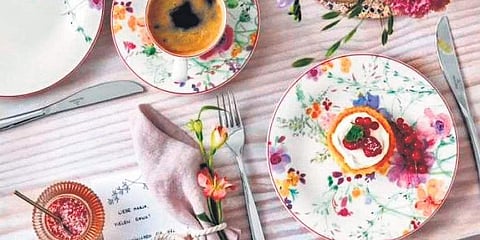 Romantic scattered patterns featuring delicate watercolour flowers in different colours and sizes decorate the plates, cups, bowls and dishes in the collection in varied designs. (File photo)