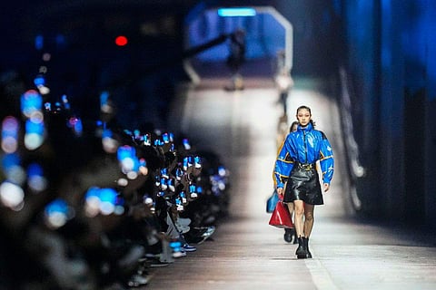 Models strutted down the Jamsugyo Bridge to music to showcase the luxury fashion house's pre-fall collection