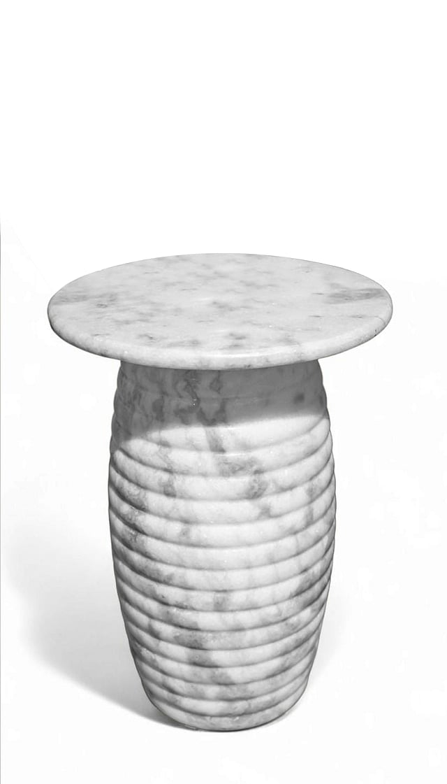 Handcrafted marble tables by Avian