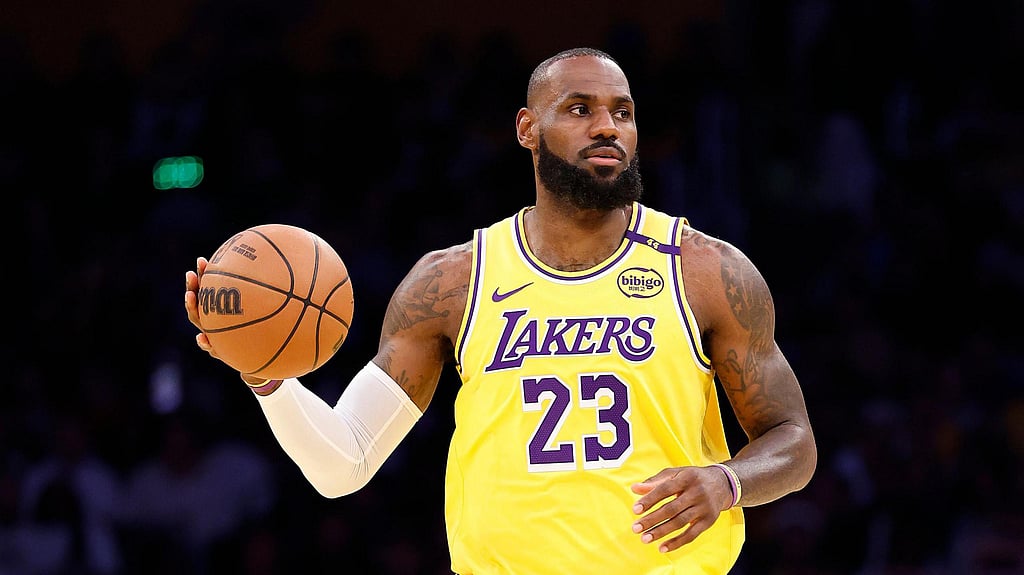 LeBron James hits a girl with the ball during NBA game, checks on her