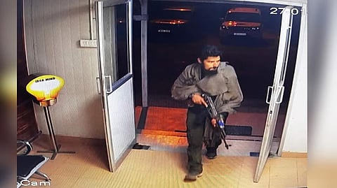 A screen grab of the CCTV footage showing the militant entering a prefabricated hut, believed to be at the Gagangir tunnel construction site.
