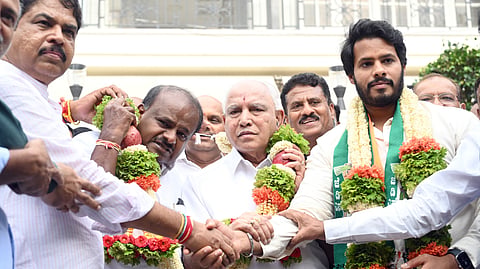 LoP in Assembly R Ashoka, Union Minister HD Kumaraswamy, former chief minister BS Yediyurappa, and NDA candidate from Channapatna, Nikhil Kumaraswamy, pose for shutterbugs, in Bengaluru on Thursday