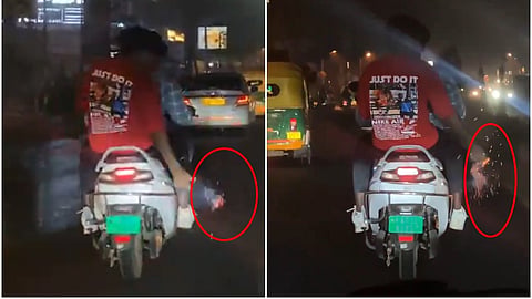 ಸ್ಕೂಟರ್ ನಲ್ಲಿ ಸಾಗುತ್ತಾ ಪಟಾಕಿ ಸಿಡಿಸುತ್ತಿರುವುದು.