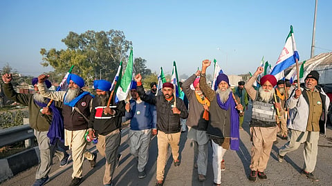 Farmers raise slogans as they gather at Shambhu border ahead of their 'Delhi Chalo' march to the national capital, in Patiala district, Punjab, Friday, Dec. 6, 2024. 