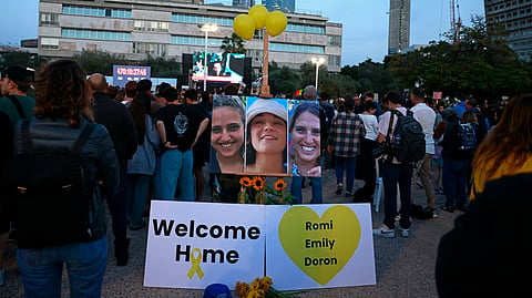 Supporters and relatives of hostages held captive in the Gaza Strip since the October 7, 2023 attacks by Palestinian militants, react while watching a live television broadcast on the release of Israeli hostages, at the Hostages Square in Tel Aviv, on January 19, 2025.