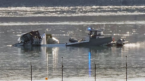 Search and rescue efforts are seen around a wreckage site in the Potomac River from Ronald Reagan Washington National Airport, early Thursday morning, Jan. 30, 2025, in Arlington