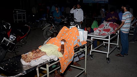 Patients being evacuated after a fire broke out at Lok Bandhu hospital, in Lucknow, Monday, April 14, 2025.