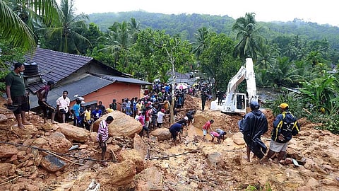 The police said the workers, employed by a private real estate group, were carrying out excavation work when the mud collapsed because of heavy rain. 