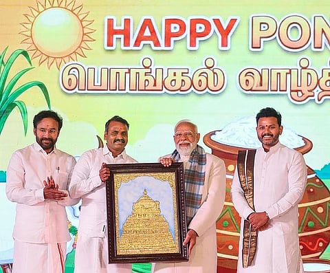 Prime Minister Narendra Modi being felicitated by Union Minister of State L Murugan 