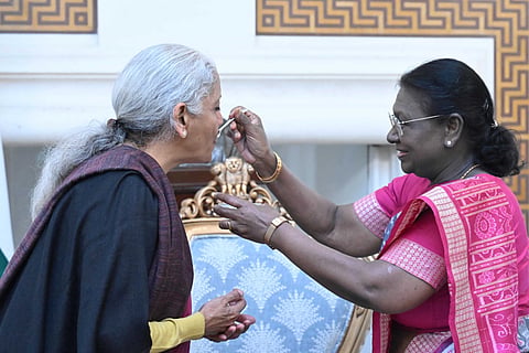 President Droupadi Murmu offers dahi-cheeni to Finance Minister Nirmala Sitharaman at Rashtrapati Bhavan
