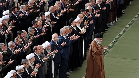 In this photo released by the official website of the office of the Iranian supreme leader, Supreme Leader Ayatollah Ali Khamenei leads an Eid al-Fitr prayer 