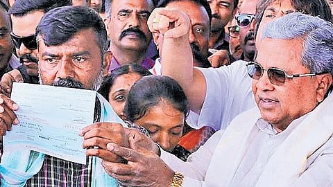 Chief Minister Siddaramaiah hands over Rs 15 lakh compensation to the grieving parents of 15-year-old Sanketh in Shivamogga on Sunday 