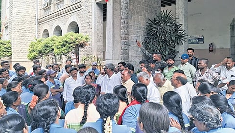 Pourakarmikas gather outside the GBA head office 