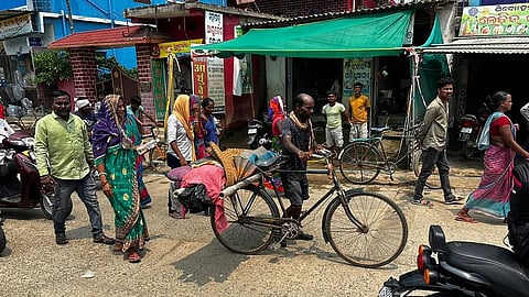 Family carries woman’s dead body on bicycle
