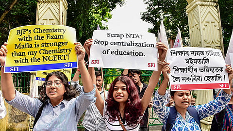 SFI members stage a protest against the National Testing Agency (NTA) over the alleged paper leak concerns following the cancellation of the NEET-UG 2026 examination