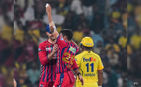 Akash Singh brings out a chit after dismissing a CSK batter.